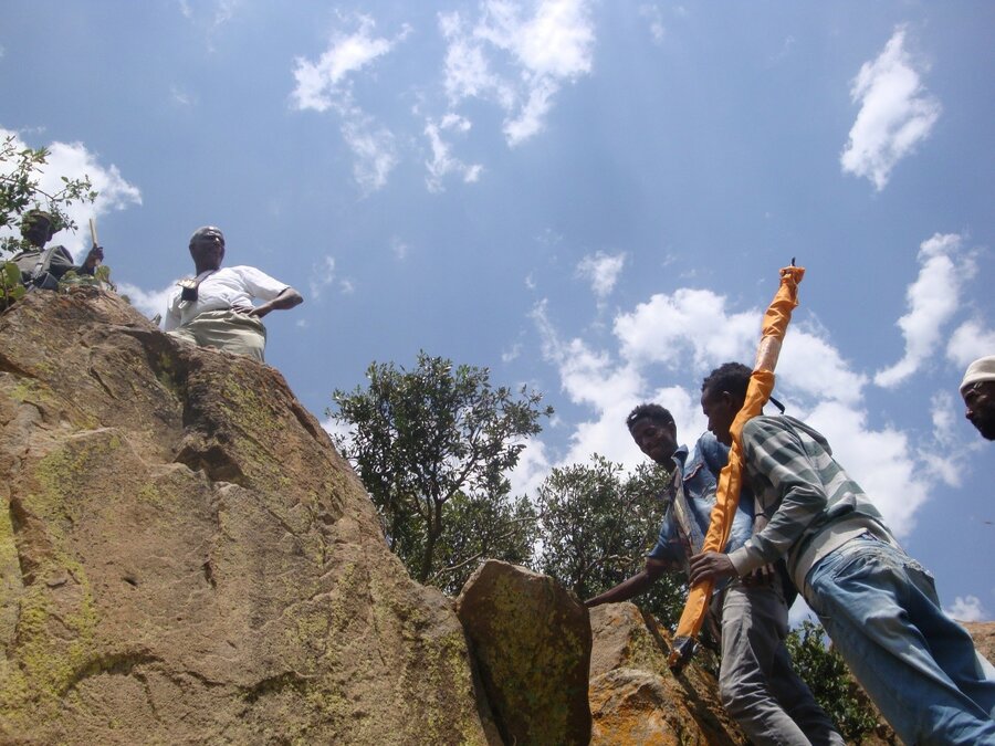 PhD candidate Mengesteab Hailu Ubuy climbing the hills during field work. 