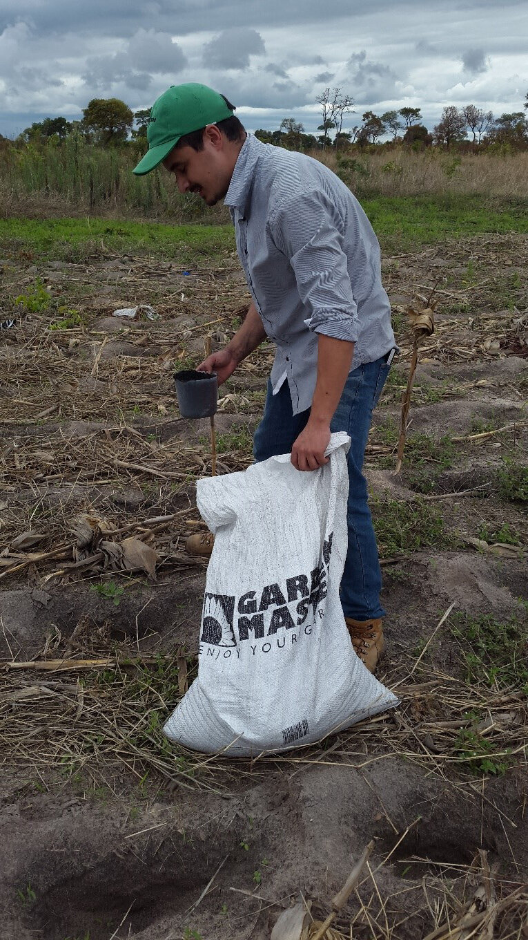 PhD candidate José Luis Munera-Echeverri adding biochar.