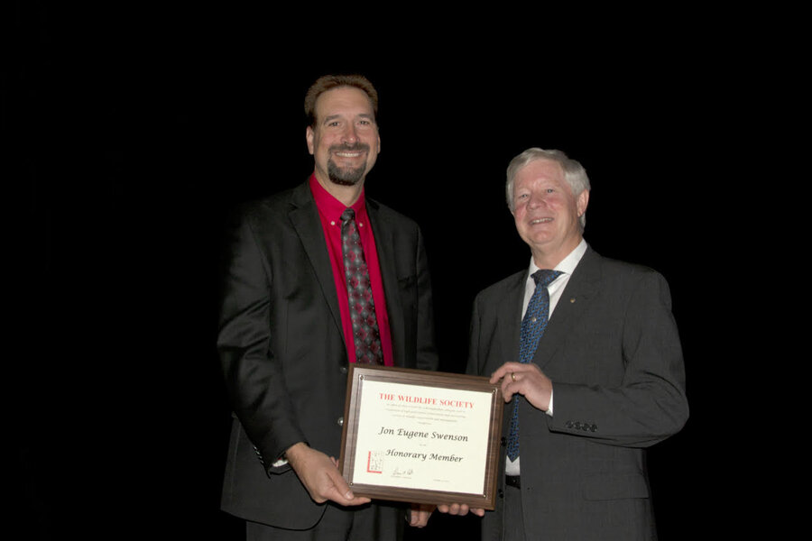 Professor Jon Swenson (right) recieves Wildlife Society’s (TWS) Honorary Membership Award from TWS' Immediate Past-President Darren A. Miller. 